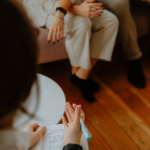 Person sitting in a counseling session, exploring self-awareness and personal growth.